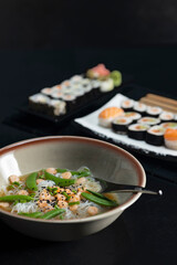 Various dishes of Asian cuisine with typical sushi