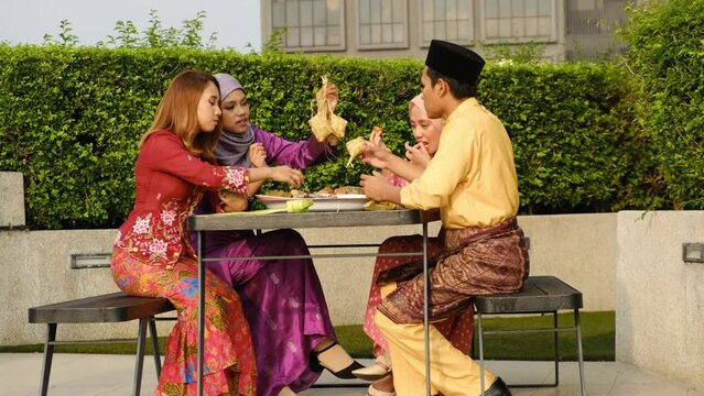 A handheld footage of family having gathering during "Hari Raya Aidilfitri" at the park. Malay celebration for Eid Mubarak". Moment waited by Malaysian, 2 years without celebration caused by covid-19.
