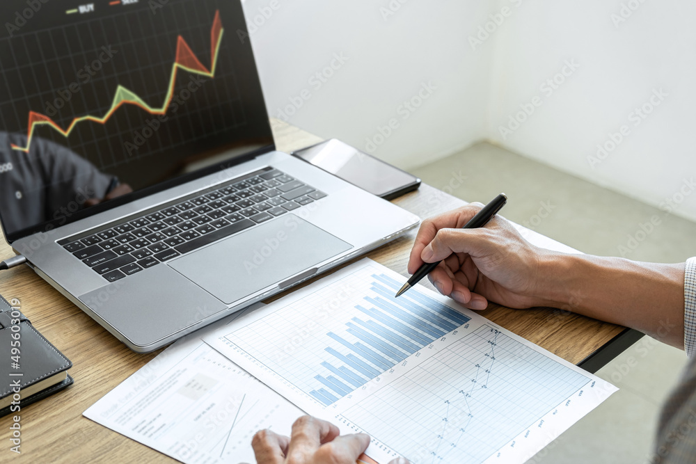 Poster Businessman working with computer, thinking and analyzing graph stock market trading with stock chart data planning, financial and investment concept