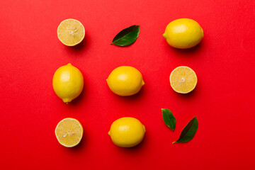 Many fresh ripe lemons as colored background, top view. Elegant background of lemon and lemon slices Top view flat lay
