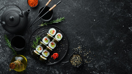 Vegetarian sushi with avocado and tomatoes. Sushi Set. Top view. Free space for your text