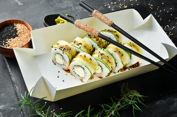 Sushi rolls with cucumber, sesame and Philadelphia cheese. Japanese food. Traditional sushi. Top view.