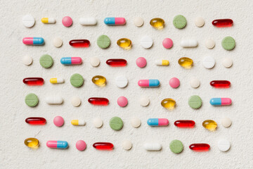 Many different pills and space for text on colorful background, top view. Different pills on color background, flat lay
