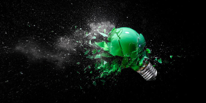 green electric light bulb exploding