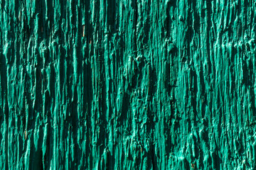 Wood painted in green color, texture background close-up view