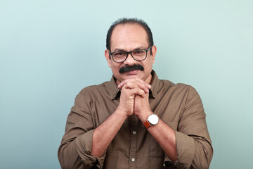 Portrait of a middle aged man of Indian ethnicity