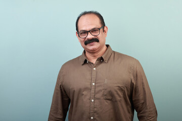 Portrait of a middle aged man of Indian ethnicity
