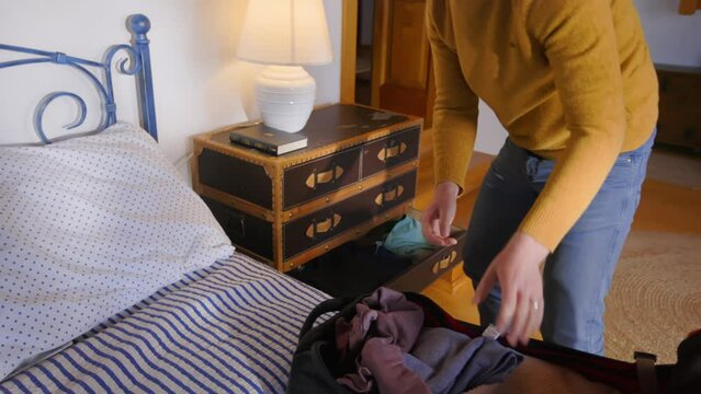 Man Packing Suitcase in a Hurry Running from War Man Ukraine Emmigration
