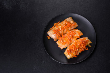 Cabbage rolls stuffed with ground beef and rice in tomato sauce