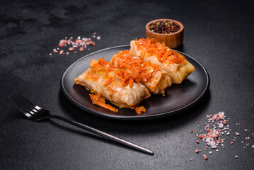Cabbage rolls stuffed with ground beef and rice in tomato sauce