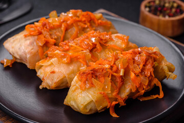 Cabbage rolls stuffed with ground beef and rice in tomato sauce