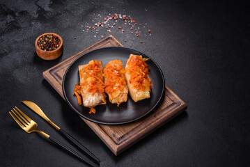 Cabbage rolls stuffed with ground beef and rice in tomato sauce