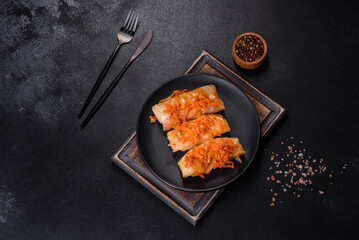 Cabbage rolls stuffed with ground beef and rice in tomato sauce