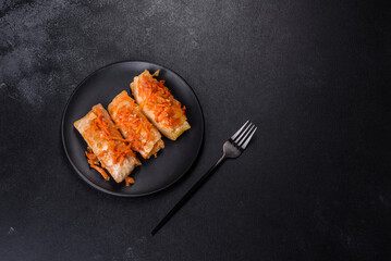 Cabbage rolls stuffed with ground beef and rice in tomato sauce