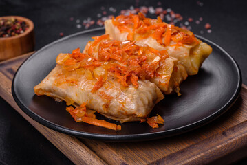 Cabbage rolls stuffed with ground beef and rice in tomato sauce