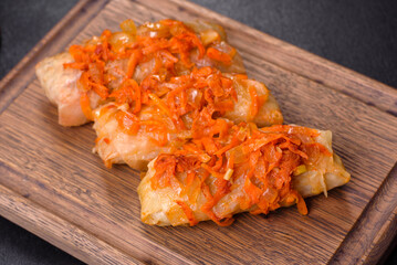 Cabbage rolls stuffed with ground beef and rice in tomato sauce