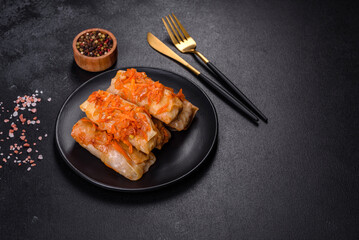 Cabbage rolls stuffed with ground beef and rice in tomato sauce