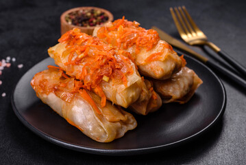 Cabbage rolls stuffed with ground beef and rice in tomato sauce