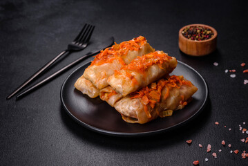 Cabbage rolls stuffed with ground beef and rice in tomato sauce