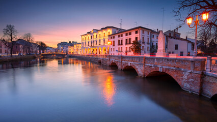 Treviso, Italy. Panoramic cityscape image of Treviso, Italy with University of Padua at spring sunset.