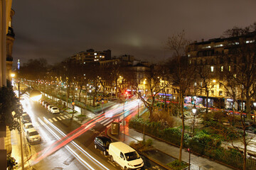Fototapeta na wymiar Light Trails Along The Parisian Streets
