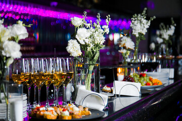 Decorated catering banquet table with different food appetizers assortment on a party