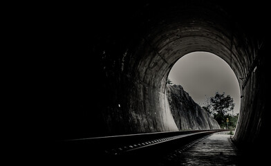 Inside the railroad tunnel and railways with natural light at the end. Light at the end of the...