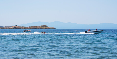 Happy People Enjoy Water Sports. Active rest on the sea.