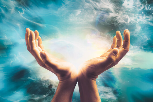 Hand sending cosmic healing energy to universe