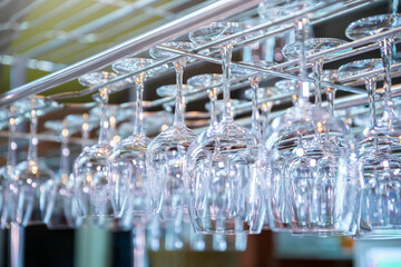 Closeup of champagne glasses in rows on table. Champagne, celebration, cheers, cocktails, glasses.