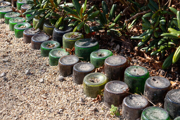  Reuse of glass bottles as a border in the garden