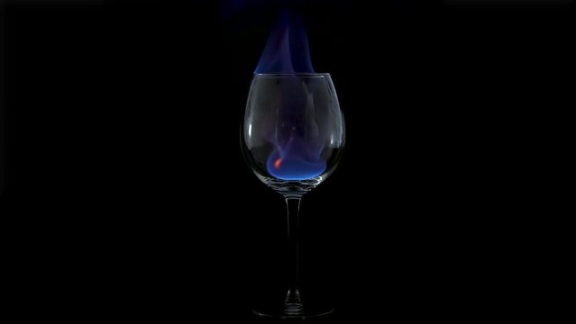 Fire ignites in a glass