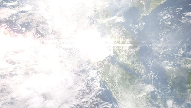 Earth zoom in from outer space to city. Zooming on Binjai, North Sumatra, Indonesia. The animation continues by zoom out through clouds and atmosphere into space. Images from NASA