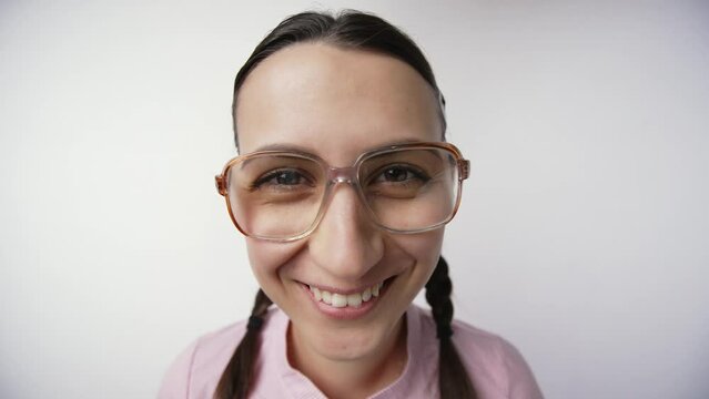 Smiling nerd girl in glasses