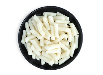 Korean food, Rice cake stick  on black plate with clipping path. (steamed rice cakes) Korean rice cakes, specifically the kind used in tteokbokki.