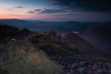 Fototapeta na wymiar Blue hour on Red Scares in Lake District, Cumbria, UK. Majestic mountain view in the evening. Beautiful landscape scenery.