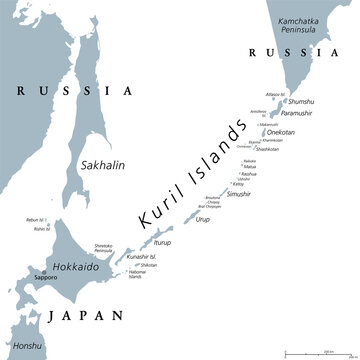 Kuril Islands, gray political map. A volcanic archipelago part of Sakhalin Oblast in Russian Far East. Stretches from Hokkaido in Japan to Kamchatka Peninsula in Russia. Under Russian administration.