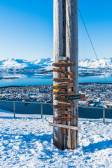 A view point with sign post located at Fjellheisen cable car overlook, mountain Storsteinen in...