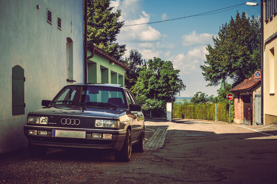 Audi Quattro german car parked in a narrow street