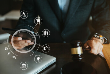 Lawyer office. gavel of Justice with scales and lawyer working on a laptop. Legal law, advice and justice concept.