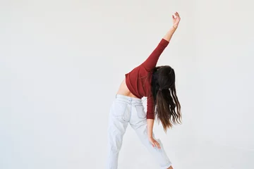 Deurstickers dancing woman lean to side and extends arm © Yuya Parker