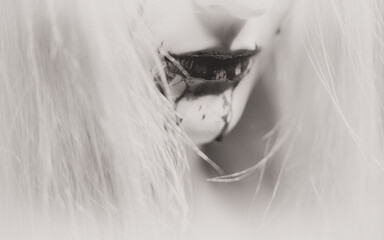 Woman with bloody mouth closeup photo