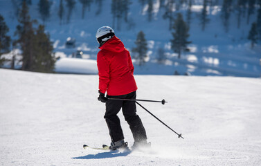 Woman down hill skiing