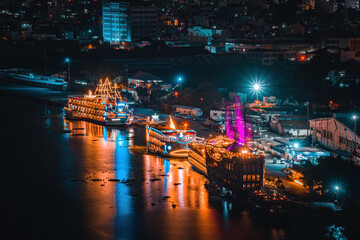 Enjoy the Nha Rong wharf and Bach Dang harbor in Ho Chi Minh City (Saigon). Colorful Saigon river at night.. Travel concept.