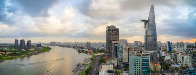 Aerial view of Bitexco Tower, buildings, roads, Thu Thiem 2 bridge and Saigon river in Ho Chi Minh...