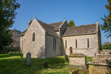 Fototapeta na wymiar St Peter's 12th Century Saxon church in the village of Southrop, The Cotswolds, England, United Kingdom