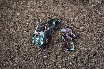 A blown up military vehicle with a Z sign. The wreckage of a Russian military vehicle