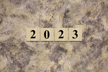 2023 on wooden block cube for new year change and start new business strategy concept.