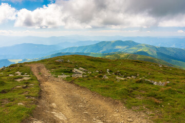 path through ridge of carpathian national park. mountain landscape of ukraine, europe in summer. beautiful outdoor scenery. domestic tourism and hiking concept. grassy hills and meadows on a sunny day