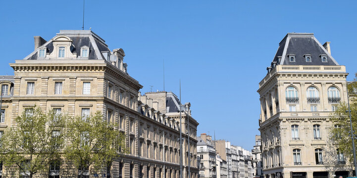 Vertical shot of Caserne Verines against blue sky on a sunny day in Paris, France